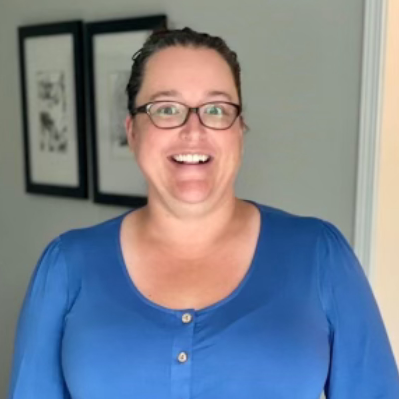 Sarah smiling in a blue shirt.